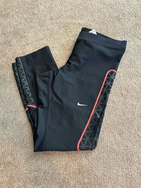 Nike Black Leggings with Coral Accent and Geometric Print